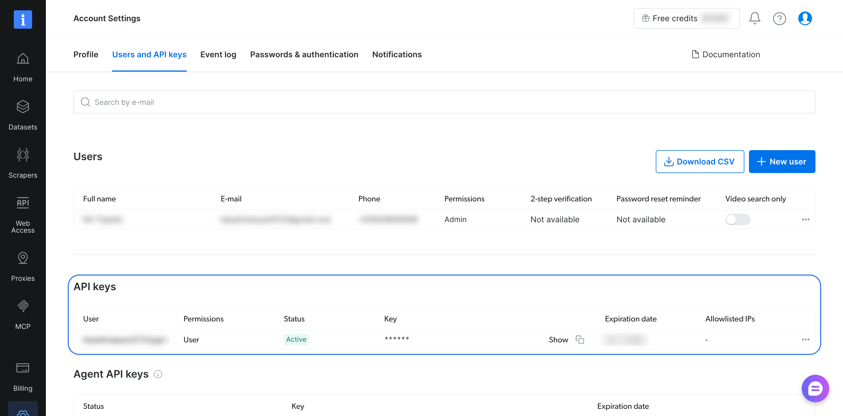 Bright Data 控制面板,显示 Account Settings 的 Users and API keys 选项卡。带边框的 API keys 表格列出了 1 个密钥,其权限为 User、状态为 Active;在选择 Show 之前,密钥处于隐藏状态。账户详细信息已模糊处理。